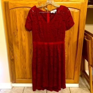 Burgundy lace dress with satin bow. Never worn. Size large.